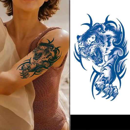 Tattoo design of a roaring tiger on a person's arm, with a blue tattoo design of a tiger on a white background.