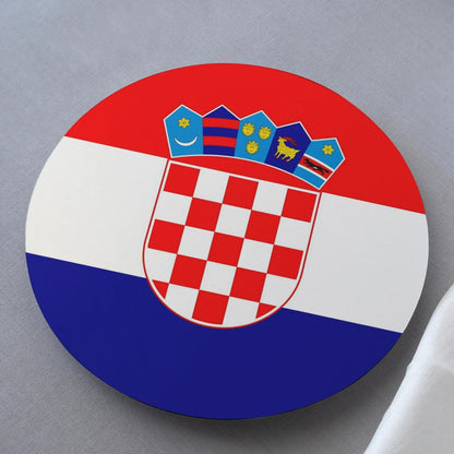 Croatian coat of arms on a round disc with red, white, and blue colors.