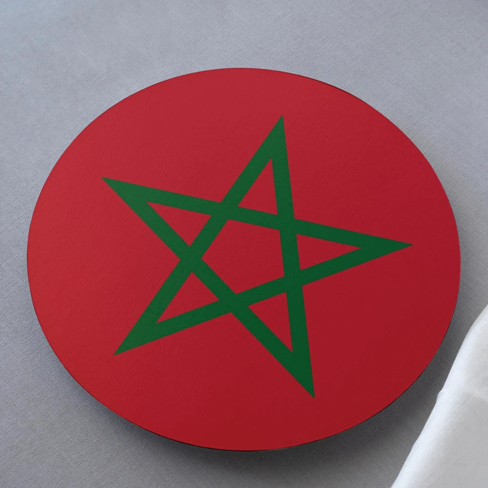 Red circular object with green star on a gray background