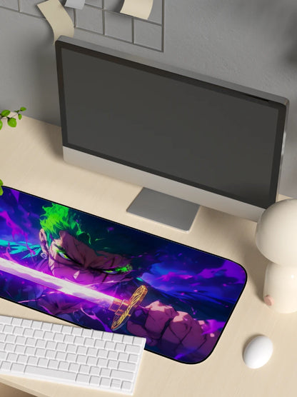 Desk setup with a computer monitor, keyboard, and mouse on a large mouse pad featuring an anime character.